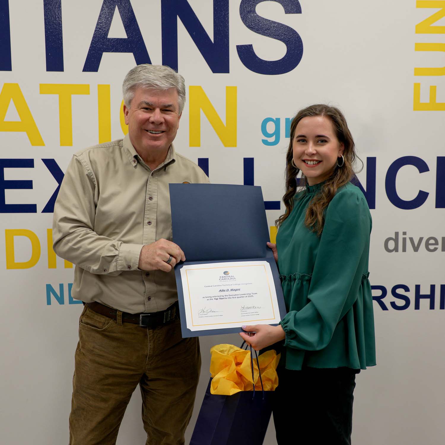 Allie Magee, standing with CCTC President Dr. Kevin Pollock, has been selected as top titan for first quarter of 2025