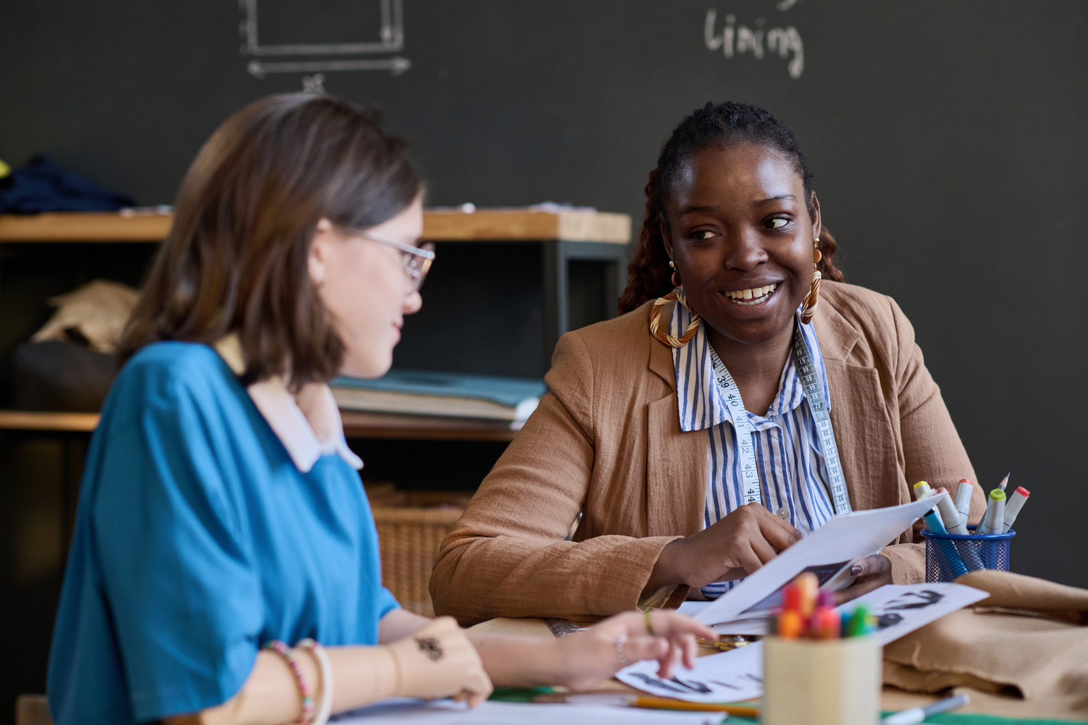 Young woman counselor consulting with another young woman.