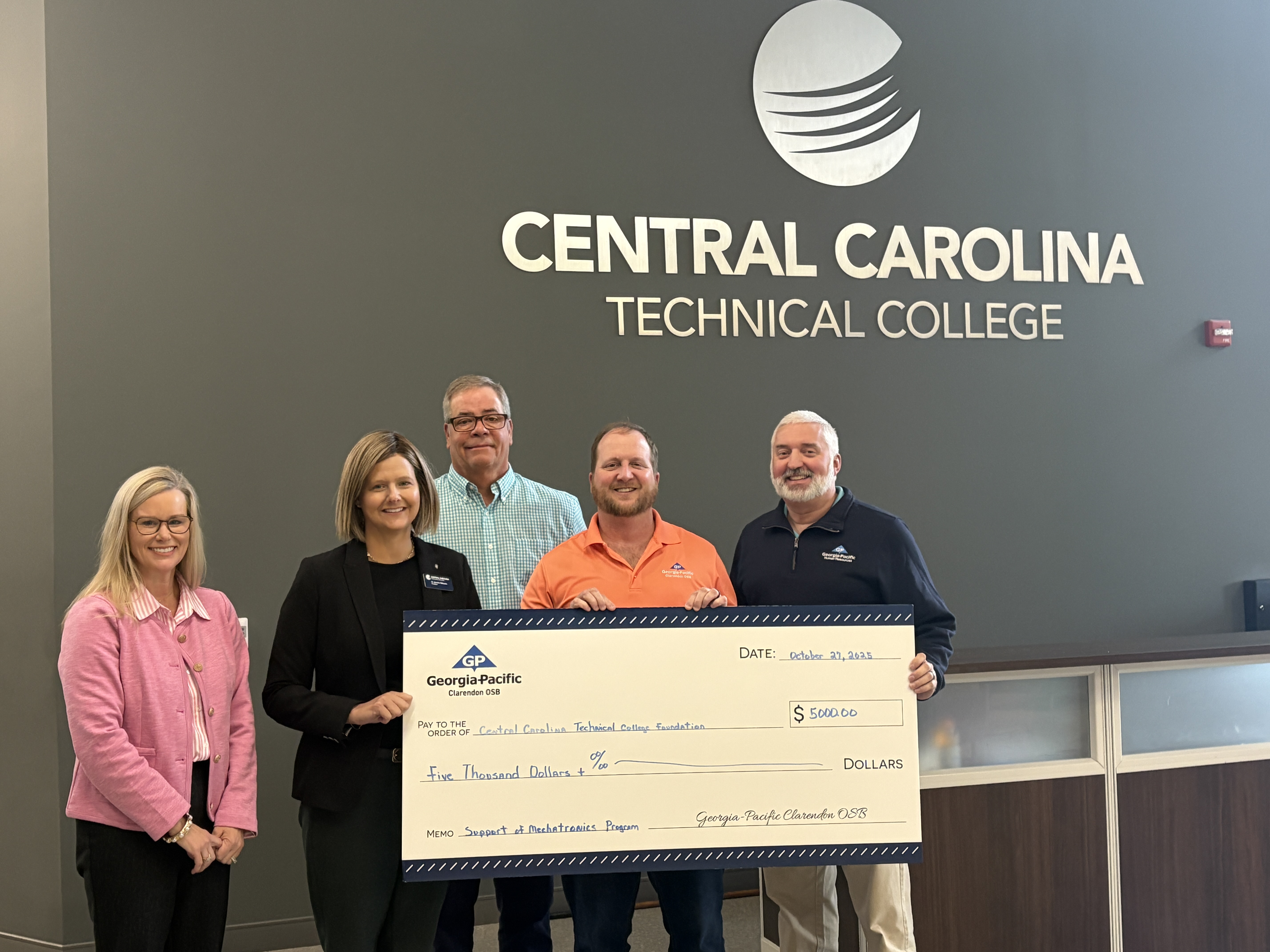 CCTC Vice President for Institutional Advancement Misty Hatfield, President Dr. Jennifer Wilbanks, Dean Bert Hancock, and Georgia-Pacific representatives Jamey Gowdy and Aubrey Morrison celebrate a $5,000 gift to the Mechatronics program.